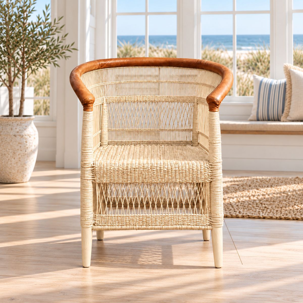 Corniche Traditional Malawi cane chair painted cream with tan leather-wrapped arm rail