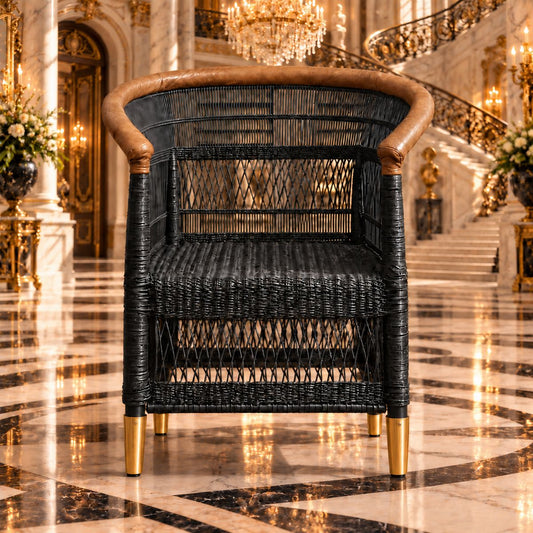 Versailles Traditional Malawi cane chair in black with tan leather-wrapped arm rail and brass feet